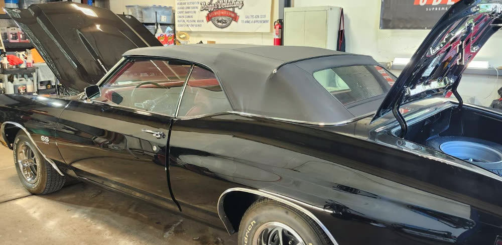 Black Chevelle SS convertible with a glossy finish inside the Briggs Detailing shop in Eau Claire