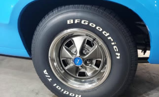 Detailed classic chrome wheel and dressed white letter tire
